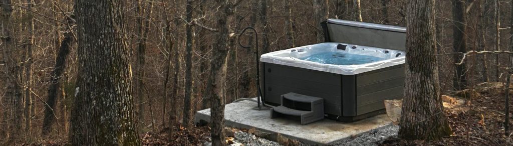 6 person hot tub over looks forest stream