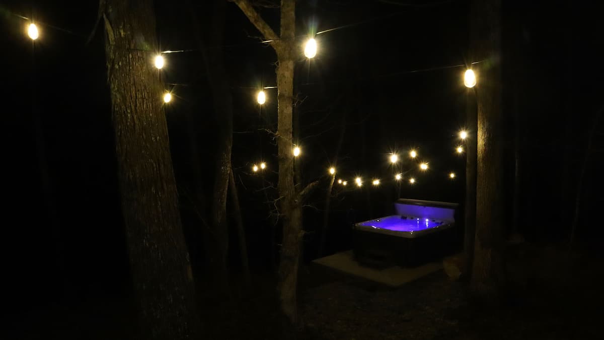 Enjoy nature sounds from the relaxing hot tub overlooking the stream.
